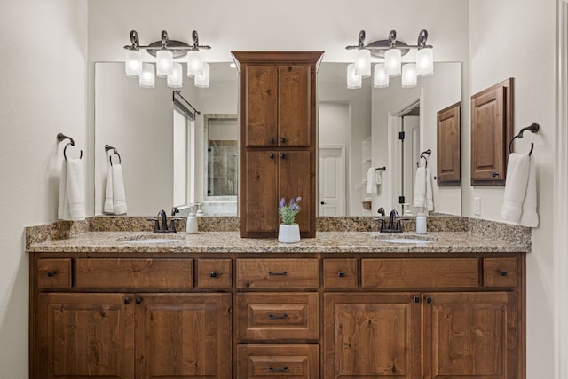 bathroom with a sink and double vanity