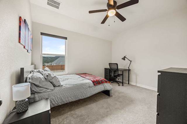 bedroom with baseboards, visible vents, ceiling fan, vaulted ceiling, and carpet flooring