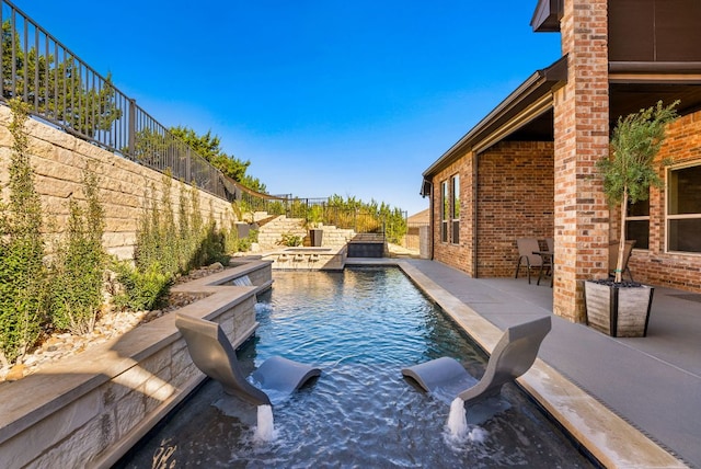 view of swimming pool featuring a patio area, a fenced backyard, and a fenced in pool