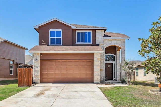 view of front facade featuring a shingled roof, concrete driveway, stone siding, an attached garage, and fence