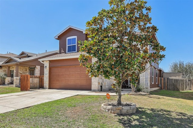 view of front of property featuring a front yard, fence, a garage, stone siding, and driveway