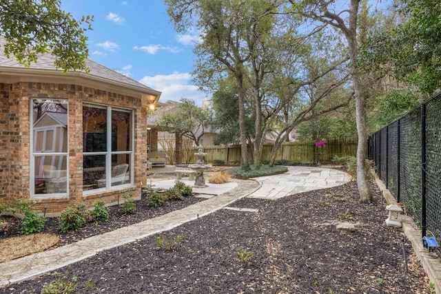 view of yard featuring a patio area and fence