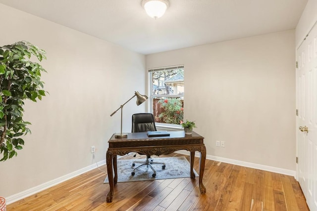 office featuring light wood-style floors and baseboards