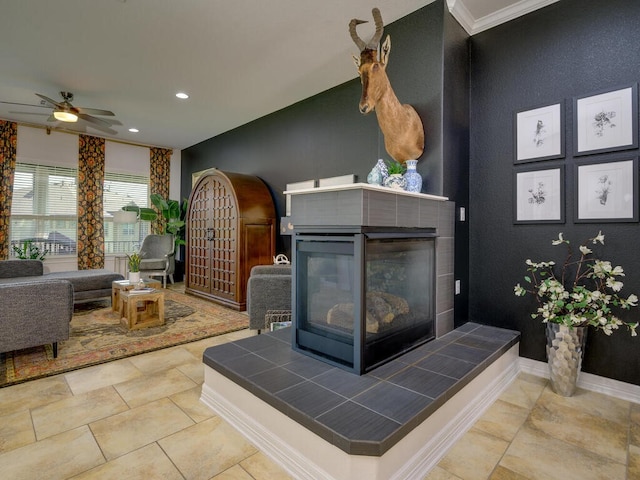 interior space with recessed lighting, a tiled fireplace, and baseboards