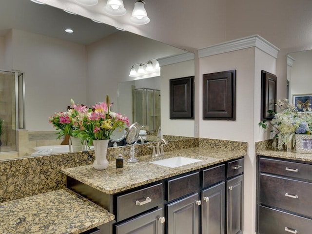 full bath featuring a stall shower and vanity