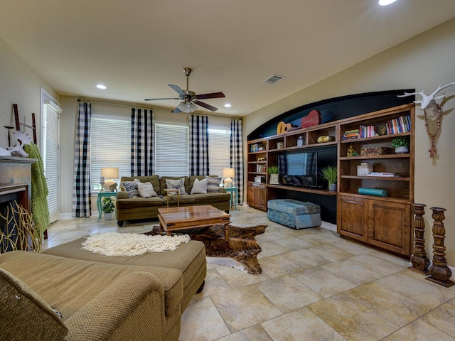 living room with recessed lighting, visible vents, a fireplace, and ceiling fan