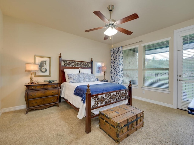 bedroom featuring baseboards, access to outside, a ceiling fan, and light colored carpet