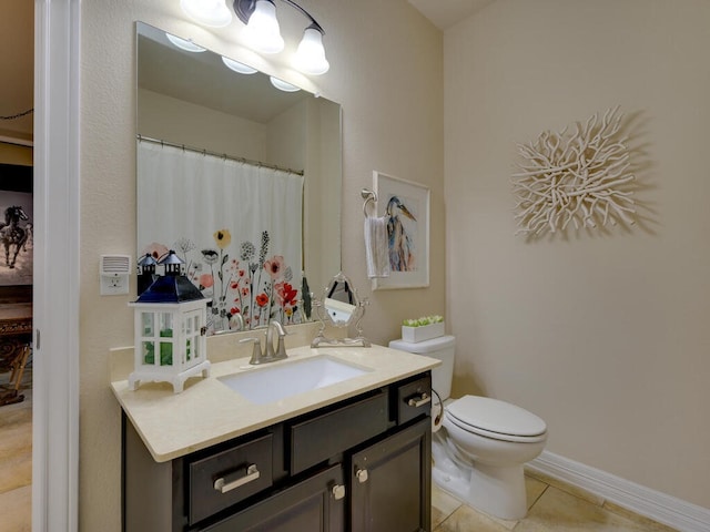 full bathroom with baseboards, vanity, toilet, and tile patterned floors