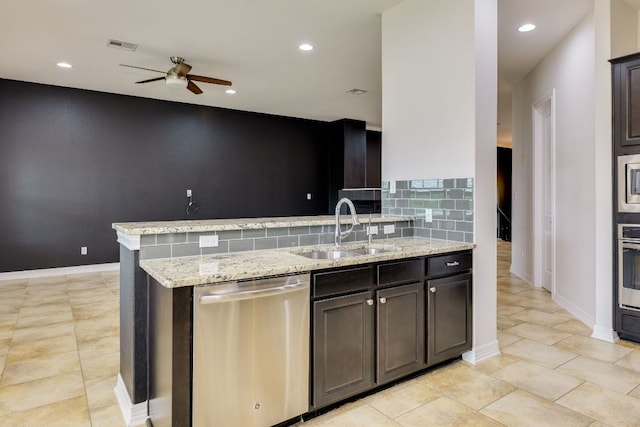 804 San Remo Blvd Unit 26B, Lakeway, TX 78734 - kitchen featuring light stone counters, a sink, ceiling fan, appliances with stainless steel finishes, and visible vents