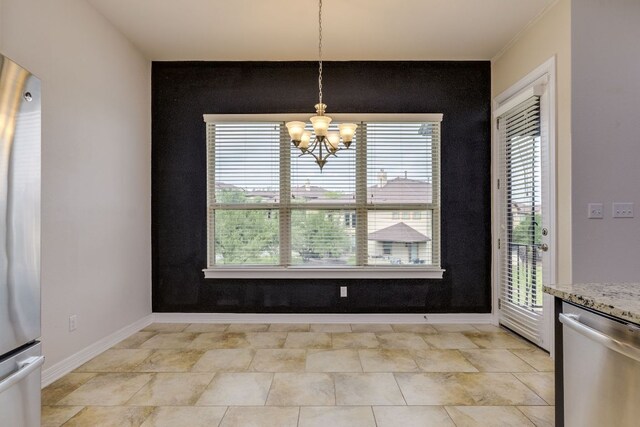 804 San Remo Blvd Unit 26B, Lakeway, TX 78734 - unfurnished dining area featuring a chandelier and an accent wall