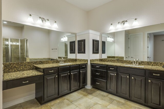 804 San Remo Blvd Unit 26B, Lakeway, TX 78734 - full bath featuring two vanities, a shower stall, and tile patterned flooring