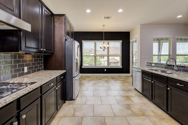 804 San Remo Blvd Unit 26B, Lakeway, TX 78734 - kitchen with a sink, visible vents, a chandelier, under cabinet range hood, and appliances with stainless steel finishes