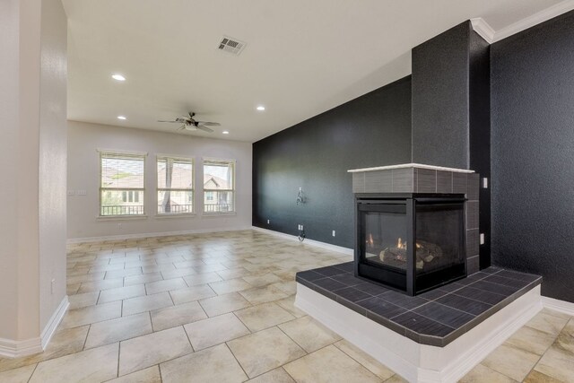 804 San Remo Blvd Unit 26B, Lakeway, TX 78734 - unfurnished living room with ceiling fan, recessed lighting, and a tile fireplace