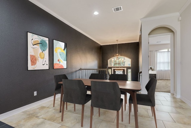 804 San Remo Blvd Unit 26B, Lakeway, TX 78734 - dining area featuring baseboards, crown molding, a chandelier, and visible vents