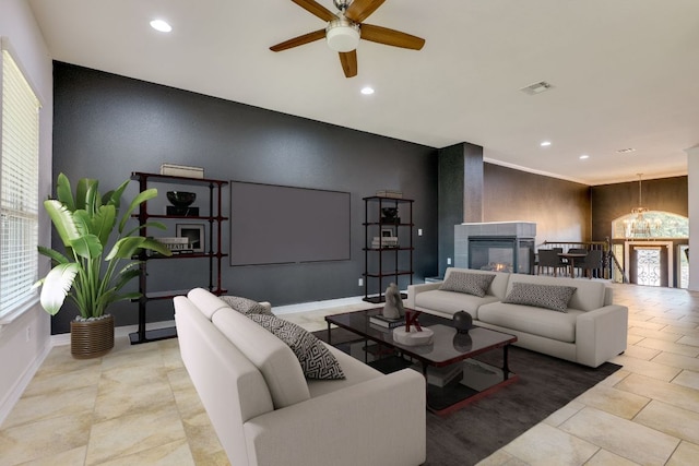 804 San Remo Blvd Unit 26B, Lakeway, TX 78734 - living area featuring an accent wall, ceiling fan with notable chandelier, visible vents, and recessed lighting