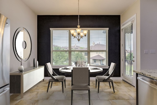 804 San Remo Blvd Unit 26B, Lakeway, TX 78734 - dining area with baseboards, an accent wall, and a chandelier