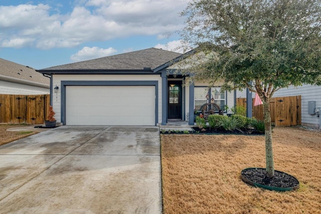 ranch-style house featuring fence, driveway, an attached garage, a shingled roof, and a front lawn