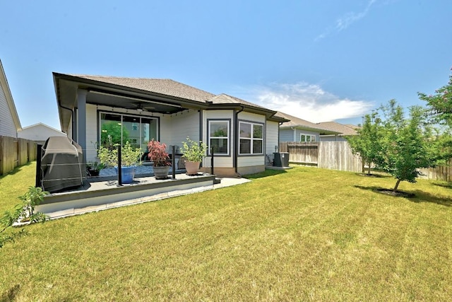 107 Trailside Ln, Bastrop, TX 78602 - rear view of house with ceiling fan, a patio, and central AC unit