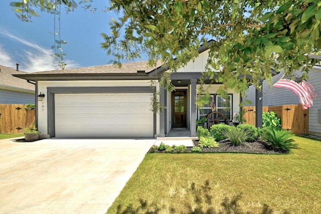 107 Trailside Ln, Bastrop, TX 78602 - view of front of house featuring driveway and an attached garage