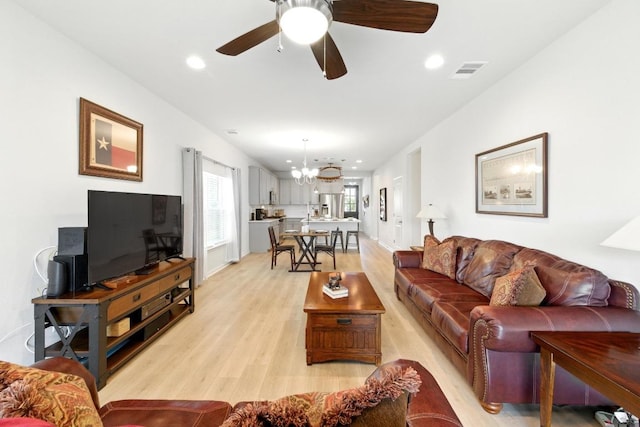 107 Trailside Ln, Bastrop, TX 78602 - living room with light wood-style floors, a chandelier, ceiling fan, recessed lighting, and baseboards
