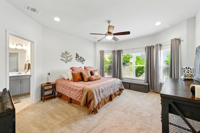 107 Trailside Ln, Bastrop, TX 78602 - bedroom featuring recessed lighting, ensuite bath, a ceiling fan, and light colored carpet