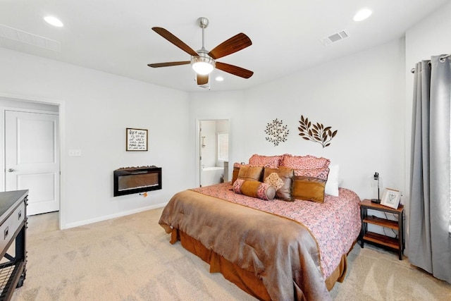 107 Trailside Ln, Bastrop, TX 78602 - bedroom featuring light colored carpet, recessed lighting, baseboards, ceiling fan, and ensuite bath