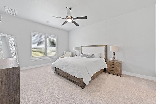 carpeted bedroom featuring visible vents, ceiling fan, and baseboards