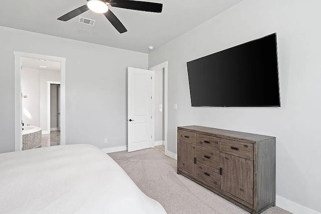 bedroom with light carpet, ceiling fan, visible vents, and baseboards