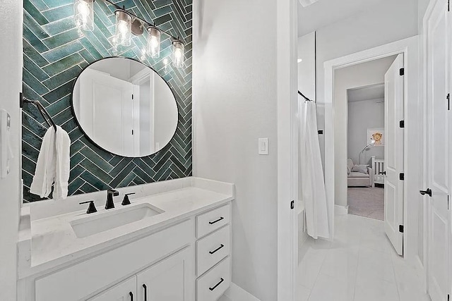 full bath with tile walls, vanity, and decorative backsplash