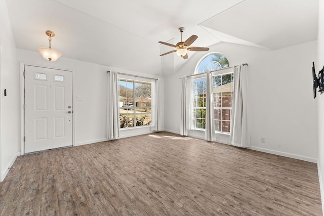 entrance foyer featuring ceiling fan, baseboards, vaulted ceiling, and wood finished floors