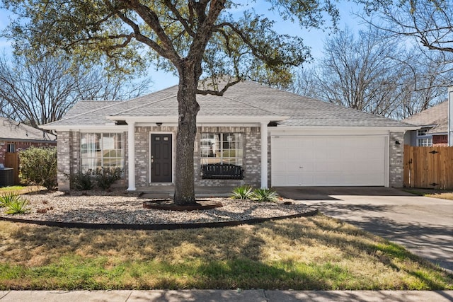 single story home with a garage, a shingled roof, central AC unit, concrete driveway, and fence