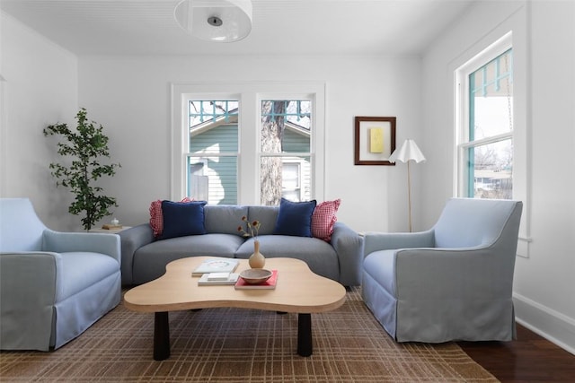 living room featuring baseboards and wood finished floors