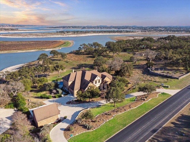 birds eye view of property featuring a water view