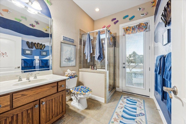 full bath with baseboards, toilet, tile patterned floors, vanity, and a shower stall