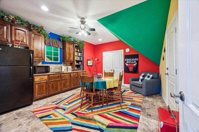 interior space with a ceiling fan and recessed lighting