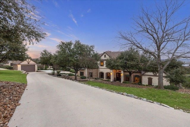 view of front of property with a lawn