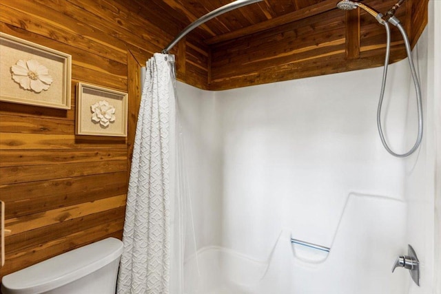 bathroom featuring toilet, wooden walls, wood ceiling, and a shower with curtain