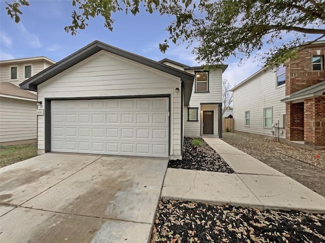 view of front of home featuring a garage and concrete driveway