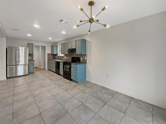 kitchen with visible vents, backsplash, under cabinet range hood, black appliances, and a notable chandelier