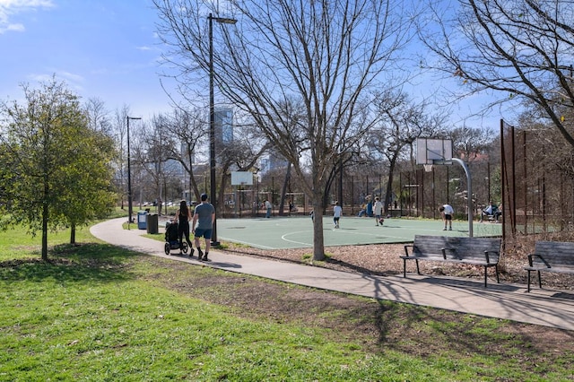 view of basketball court featuring community basketball court and a yard