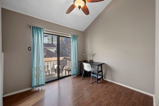 office space with lofted ceiling, ceiling fan, wood finished floors, and baseboards