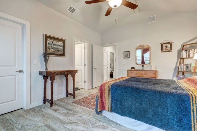 bedroom featuring lofted ceiling, baseboards, visible vents, and a ceiling fan