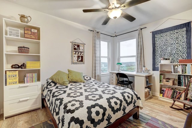 bedroom with ceiling fan and wood finished floors