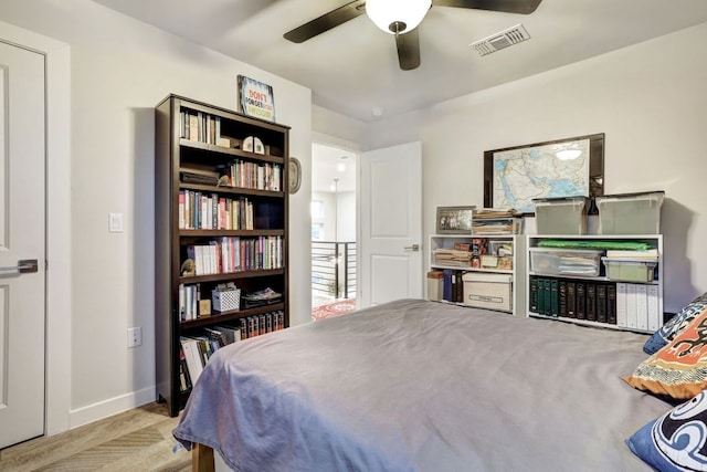 bedroom featuring ceiling fan, visible vents, and baseboards