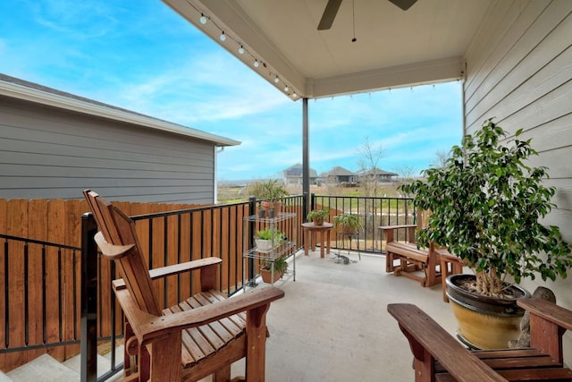 view of patio featuring a balcony and ceiling fan