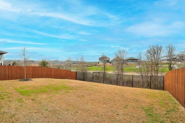 view of yard featuring a fenced backyard