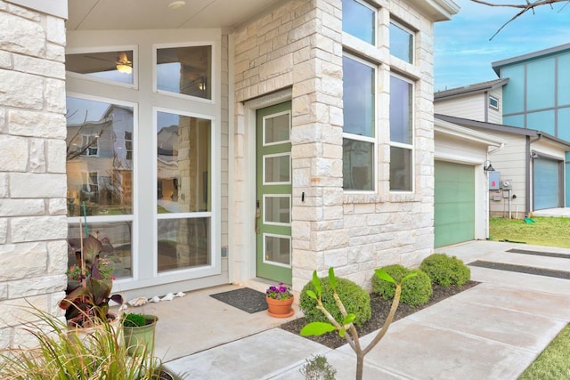 property entrance featuring stone siding