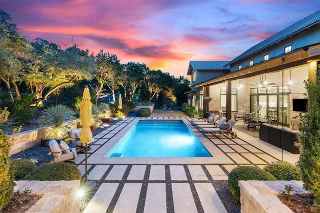 pool with a patio