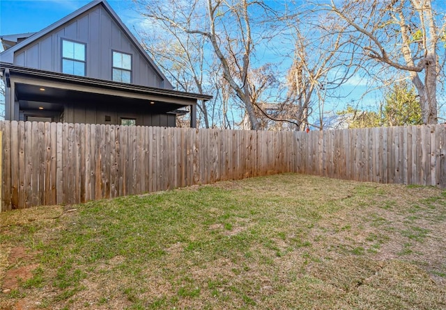 view of yard with a fenced backyard