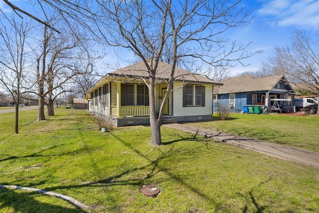bungalow-style house featuring a front yard and crawl space